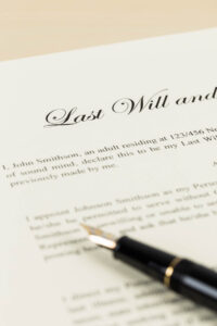 a copy of a will with a pen on top