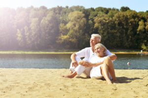 elderly couple on the sand